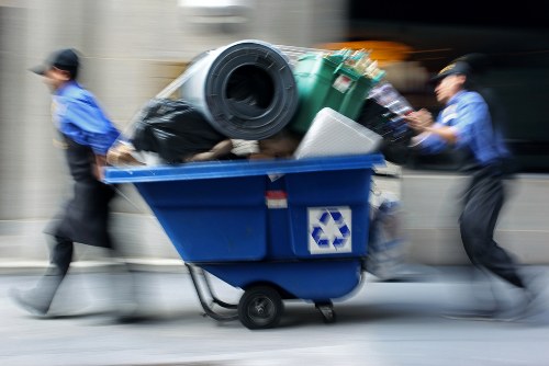 Operative segregating waste into containers during rubbish collection